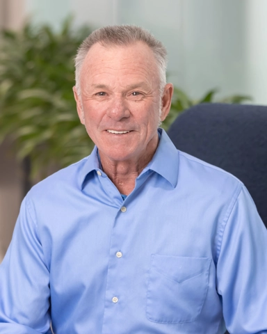 portrait of a smiling person in professional attire